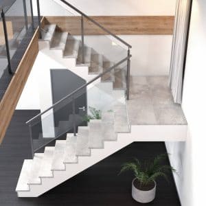 Escalera cerrada con acabado de piedra o baldosa