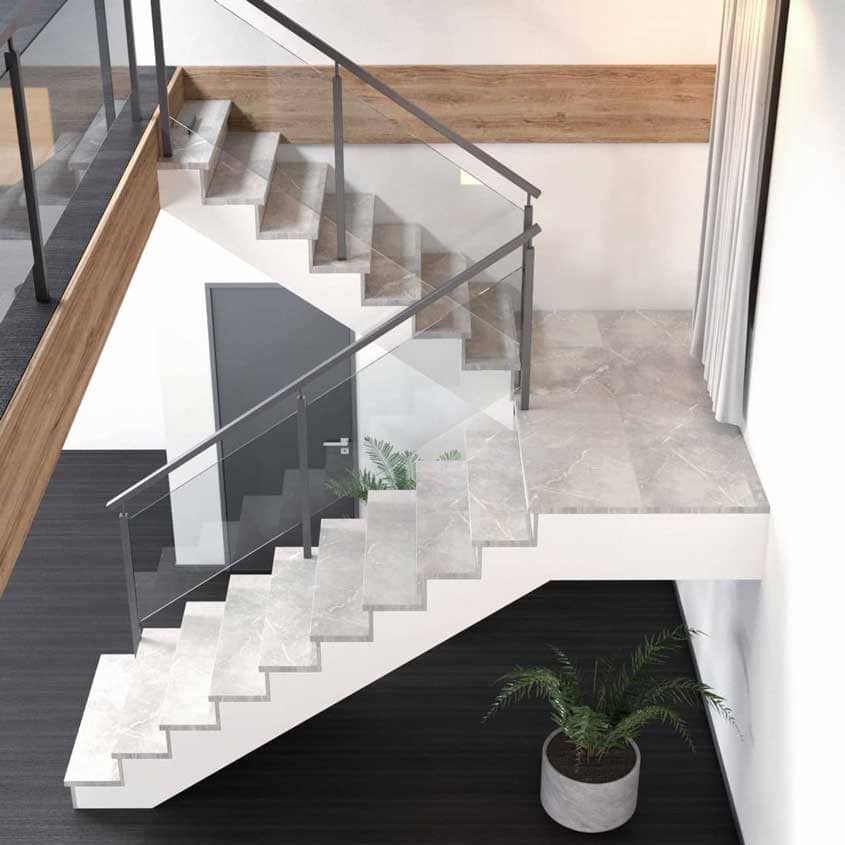 Escalera cerrada con acabado de piedra o baldosa